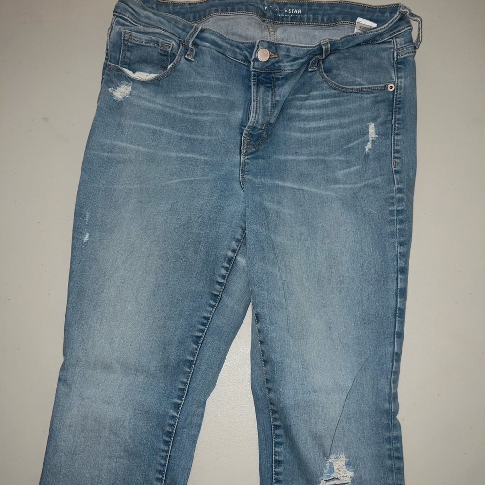 Skinny jeans with small distress in them.